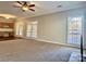 Open living room with access to kitchen and patio at 3837 Beauvista Dr, Charlotte, NC 28269