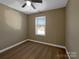 Spacious bedroom with neutral carpeting and a ceiling fan at 101 W Park Dr, Stanley, NC 28164