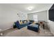 Comfortable game room featuring a sectional sofa, ottoman, and foosball table at 1568 Whitman Ct, York, SC 29745