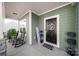 Inviting front porch with rocking chairs and decorative accents at 1568 Whitman Ct, York, SC 29745