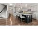 Open concept kitchen with large island, stainless steel appliances, and a view of the living area at 1568 Whitman Ct, York, SC 29745