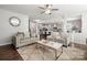 Bright living room featuring a comfy seating area, large windows, and open floor plan at 1568 Whitman Ct, York, SC 29745