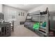 Bedroom with bunk beds, a study desk, and Teenage Mutant Ninja Turtles decor at 1568 Whitman Ct, York, SC 29745