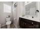Clean bathroom with dark vanity, toilet and shower at 1568 Whitman Ct, York, SC 29745