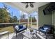 Relaxing screened porch with wicker furniture and ceiling fan at 1568 Whitman Ct, York, SC 29745
