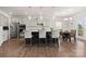 Open kitchen with gray cabinets, breakfast bar, and stainless steel appliances at 1568 Whitman Ct, York, SC 29745