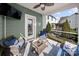 Outdoor screened porch overlooking backyard with patio furniture at 1568 Whitman Ct, York, SC 29745