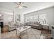 Open concept living room with neutral decor and views to kitchen and dining area at 1568 Whitman Ct, York, SC 29745