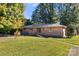 Brick ranch house with accessible ramp and yard at 1102 W Elm St, Shelby, NC 28152