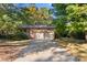 Brick ranch house with a two-car garage and driveway at 1102 W Elm St, Shelby, NC 28152