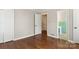 Hardwood floor bedroom with access to bathroom at 1102 W Elm St, Shelby, NC 28152
