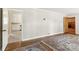 Spacious living room with hardwood floors and access to kitchen at 1102 W Elm St, Shelby, NC 28152