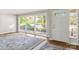 Living room with hardwood floors, large windows, and view of front yard at 1102 W Elm St, Shelby, NC 28152