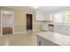 Kitchen featuring white cabinets and a view into another room at 1102 W Elm St, Shelby, NC 28152
