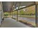 Inviting front porch with ceiling fan and view of the yard at 103 Buck Hill Rd, Monroe, NC 28112