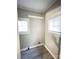 Bright laundry room with two windows and vinyl flooring at 2123 W 6Th Ave, Gastonia, NC 28052