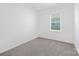 Bright bedroom with neutral carpeting and window at 3469 Buck Ct # 37, Gastonia, NC 28056