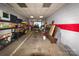 Workshop with shelving, workbench, and vehicle storage at 907 Bethlehem Rd, Kings Mountain, NC 28086