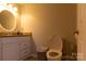 Basement bathroom with single vanity, granite countertop, and toilet at 907 Bethlehem Rd, Kings Mountain, NC 28086
