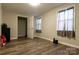 Small bedroom with hardwood floors, closet, and two windows at 907 Bethlehem Rd, Kings Mountain, NC 28086