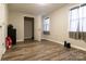 Small bedroom with hardwood floors, closet, and two windows at 907 Bethlehem Rd, Kings Mountain, NC 28086