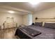 Spacious finished basement bedroom with large bed, dresser, and walk-in closet at 907 Bethlehem Rd, Kings Mountain, NC 28086