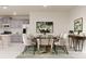 Elegant dining room with a large table, gray cabinets and a view of the kitchen at 376 Bly St, Rock Hill, SC 29732