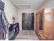 Foyer with wood-look flooring and coat rack at 3808 Lawrence Ct, Monroe, NC 28110