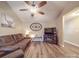 Living room with brown leather couch and a TV at 3808 Lawrence Ct, Monroe, NC 28110