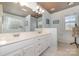 Bathroom with double vanity and a large mirror at 7894 Woodmere Dr, Harrisburg, NC 28075