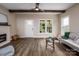 Bright and airy living room with exposed beams and fireplace at 814 Jost St, Statesville, NC 28677