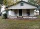 White house with green trim and porch at 120 Legionaire Dr, Lincolnton, NC 28092