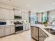 Modern kitchen with stainless steel appliances and white cabinets at 1804 Otter Perch Ln, Fort Mill, SC 29715