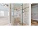 Bathroom with walk-in shower, tile surround, and glass door at 3714 Radbourne Blvd, Charlotte, NC 28269