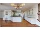 Spacious kitchen with island, white cabinets, and hardwood floors at 3714 Radbourne Blvd, Charlotte, NC 28269