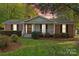 Brick ranch house with covered porch and mature landscaping at 520 Briar Creek Rd, Gastonia, NC 28056