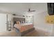 Main bedroom with a tufted headboard and neutral bedding at 520 Briar Creek Rd, Gastonia, NC 28056