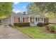 Brick ranch house with attached garage and well-maintained lawn at 520 Briar Creek Rd, Gastonia, NC 28056