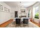 Formal dining room with hardwood floors and large windows at 70 Spring Nw St, Concord, NC 28025