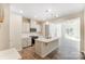 Modern kitchen with island, white cabinets, and stainless steel appliances at 14913 Tamarack Dr, Charlotte, NC 28278