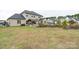 Large backyard with home and landscaping at 5051 Hyannis Ct, Matthews, NC 28104