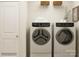 Laundry room with washer, dryer, and shelving at 4476 Potter Wheel Dr, Fort Mill, SC 29715