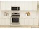 Kitchen with stainless steel appliances and white cabinets at 4476 Potter Wheel Dr, Fort Mill, SC 29715