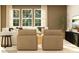Living area with two armchairs and a view of a large window at 4476 Potter Wheel Dr, Fort Mill, SC 29715