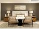 Serene bedroom with king-size bed and two accent chairs at 4476 Potter Wheel Dr, Fort Mill, SC 29715