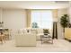 Cozy living room boasting a sectional sofa and large window at 4476 Potter Wheel Dr, Fort Mill, SC 29715