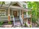 Inviting front porch with wooden stairs and railing at 10008 Cuyo Ct, Tega Cay, SC 29708