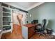 Spacious home office with hardwood floors and built-in shelving at 10008 Cuyo Ct, Tega Cay, SC 29708