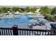 Relaxing community pool with plenty of lounge chairs and umbrellas at 4476 Potter Wheel Dr, Fort Mill, SC 29715