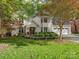 Two-story house with stucco exterior, landscaped yard, and a two-car garage at 112 N Sardis View Ln, Charlotte, NC 28270